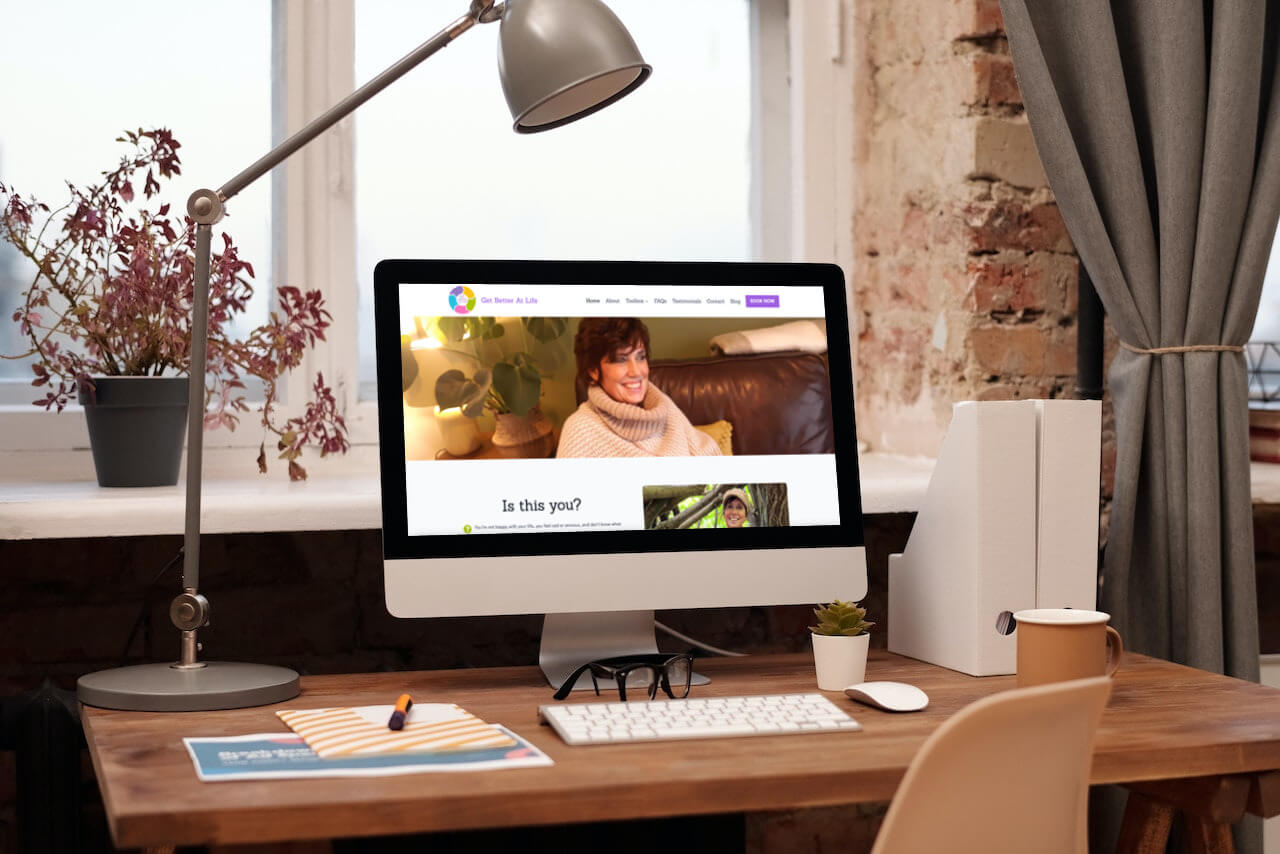 image of imac screen with Get Better at Life website displayed